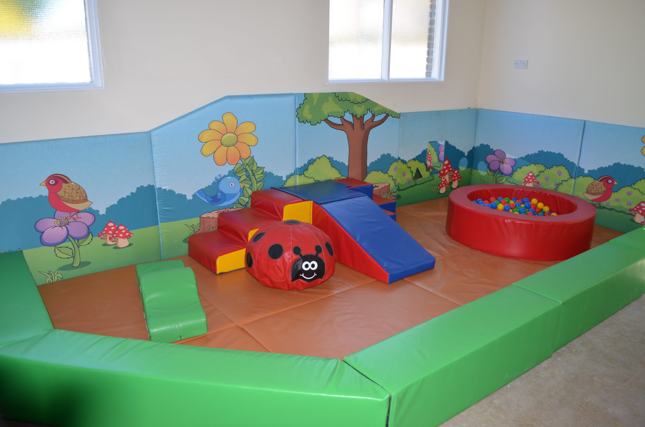 A small play area featuring a ball pit, designed for children