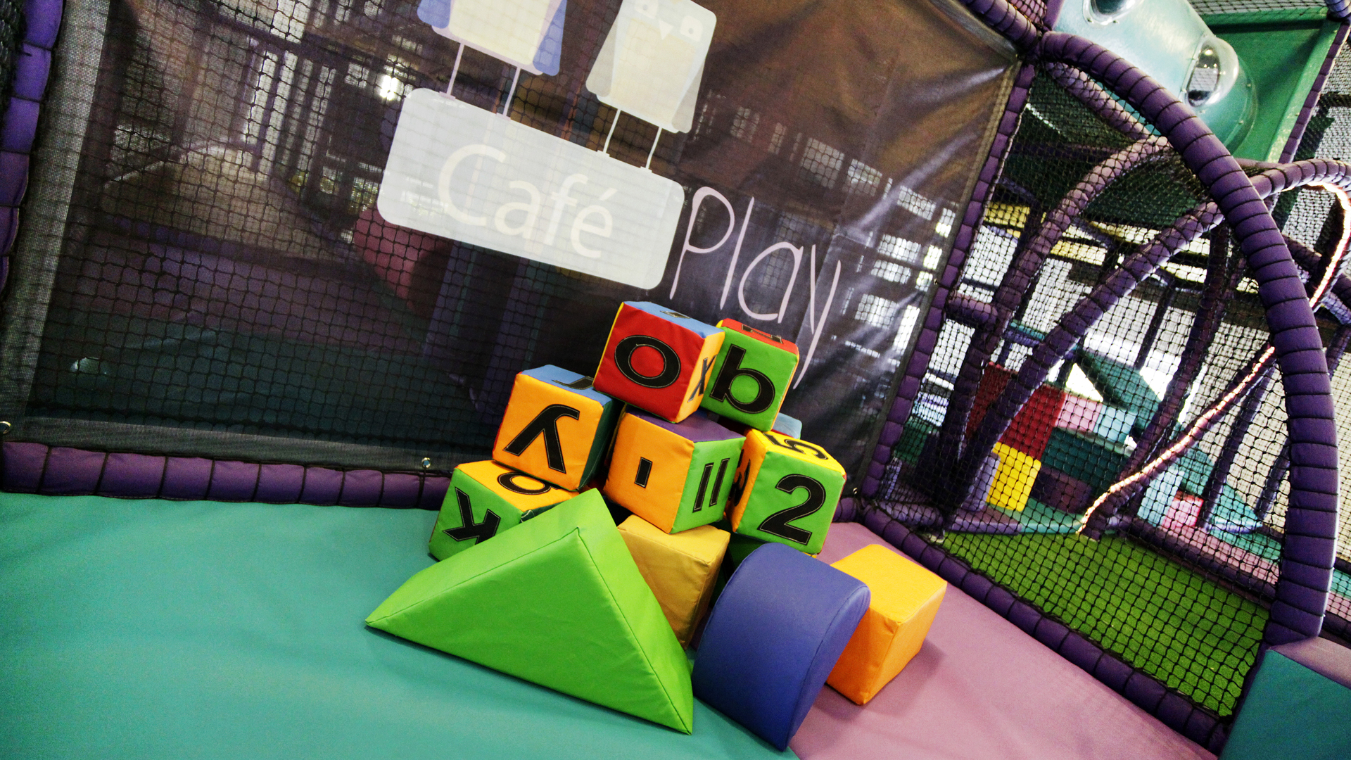 A vibrant play area filled with colourful, inviting children to explore and engage in creative play.