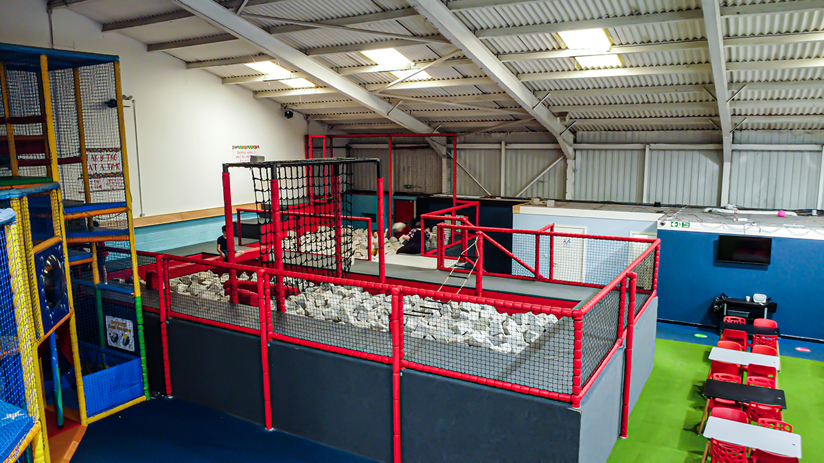 An indoor play zone with play equipment for children