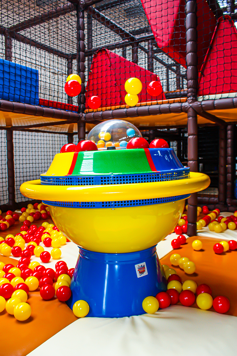 A ball machine in the middle of a play area